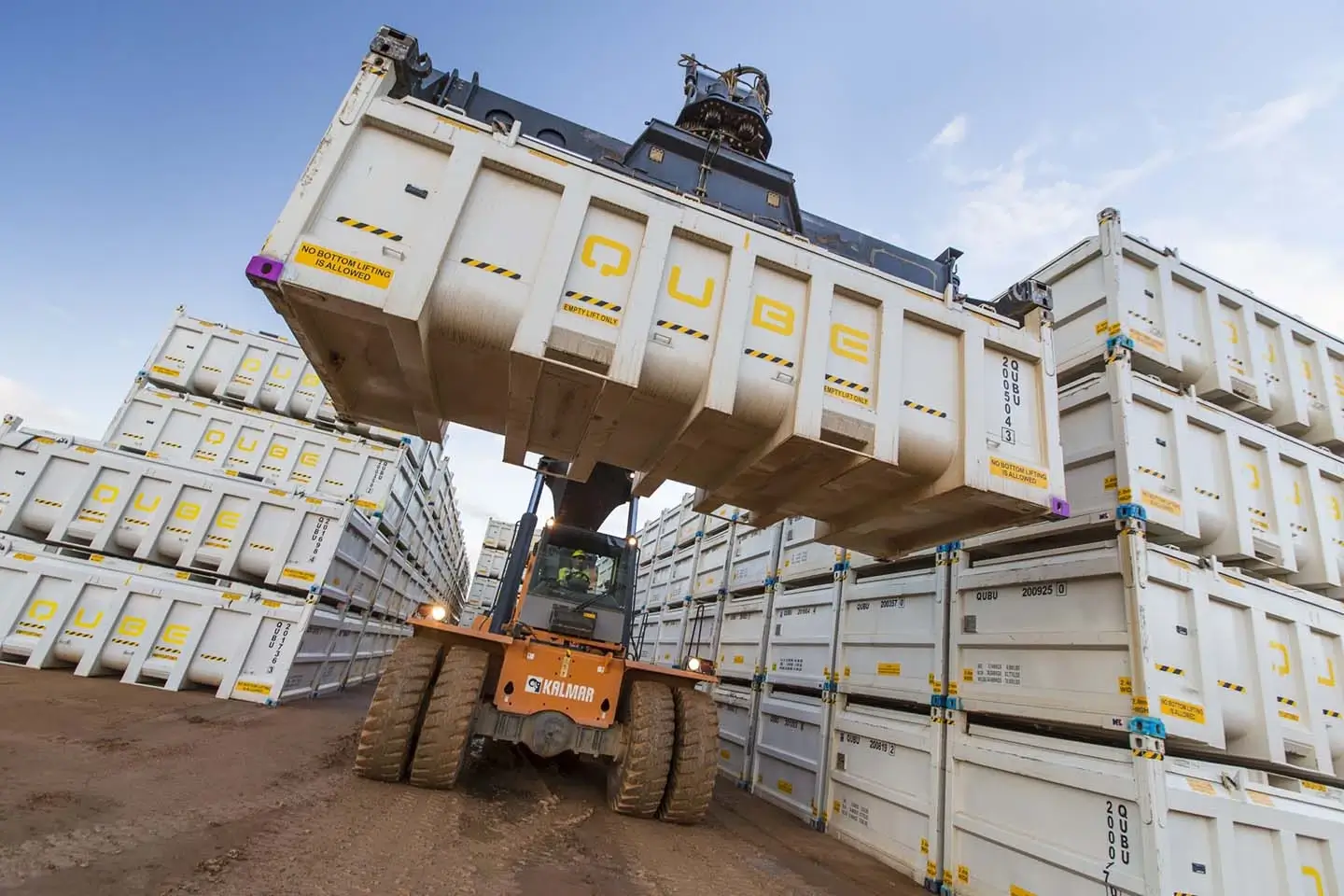 Qube container being carried by forklift