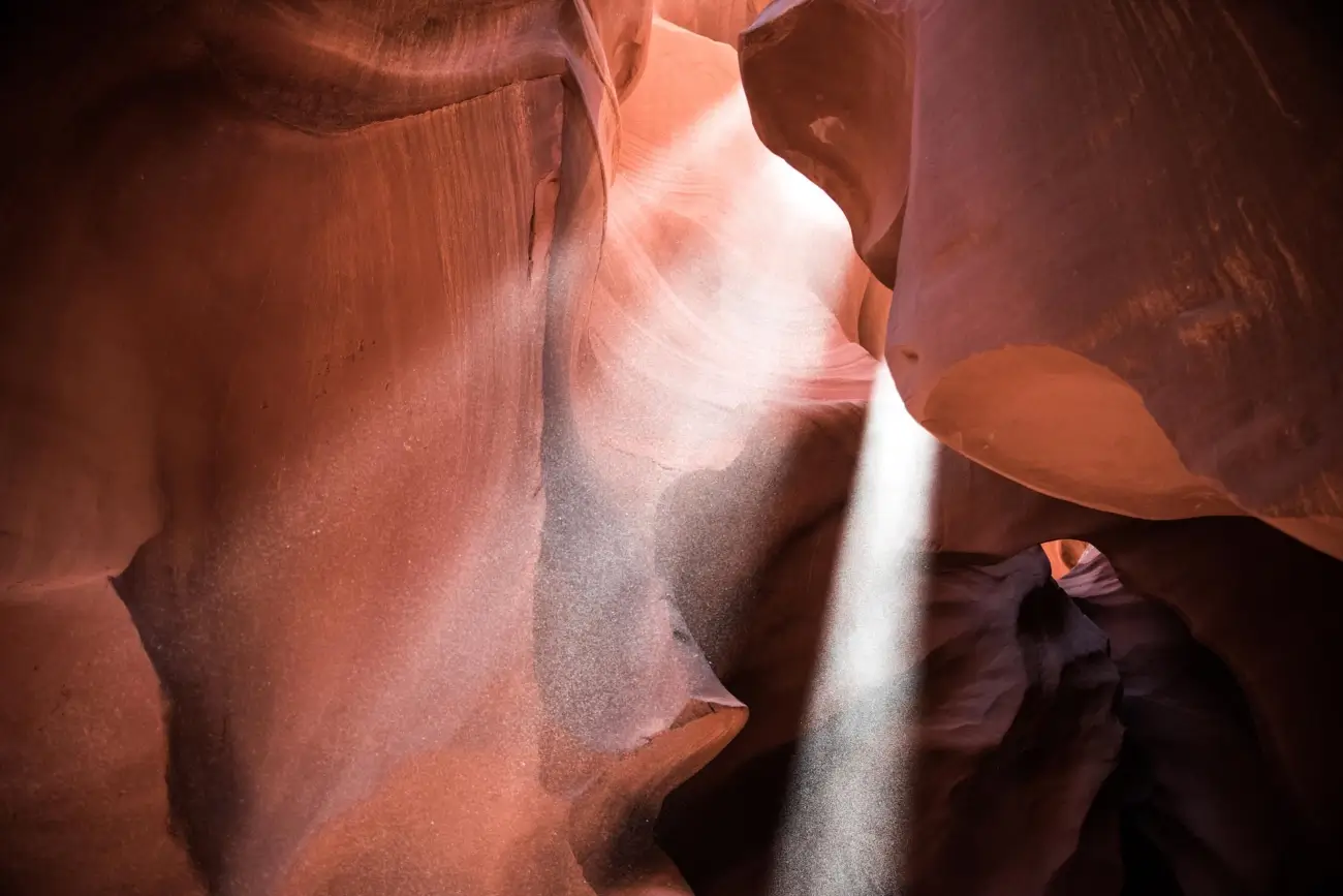 Sun shining through red rocks